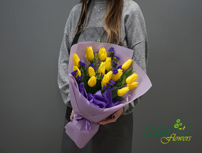 Bouquet of yellow tulips and statice photo